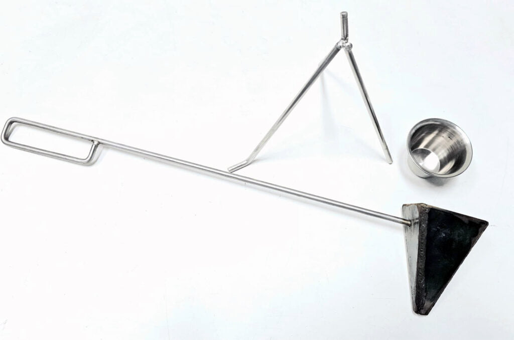 Flambadou with Bag Stand and Cup – fat being poured over braai meat